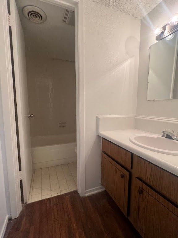 311 East 31st Street, Unit 205 Austin, TX 78705 - Photo 7 of 17 a bathroom with a sink and a mirror