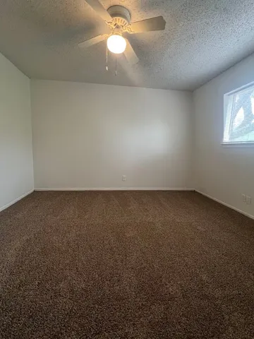 an empty room with a empty space and a window