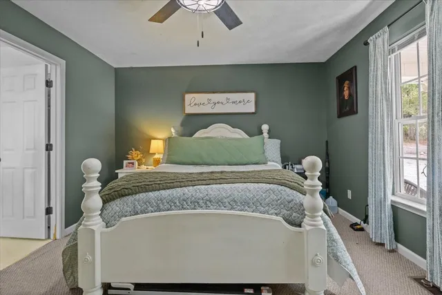 a bedroom with a bed and window