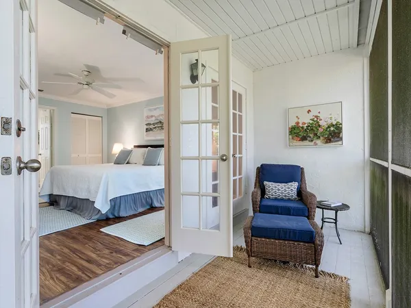 a bedroom with furniture and a rug