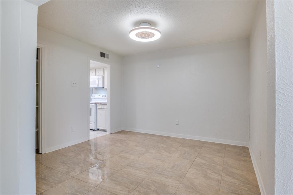 11348 McCree Road Dallas, TX 75238 - Photo 4 of 15 a view of an empty room and a window