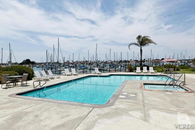2901 Peninsula Road, Unit 150 Oxnard, CA 93035 - Photo 18 of 24 a view of a swimming pool with outdoor seating