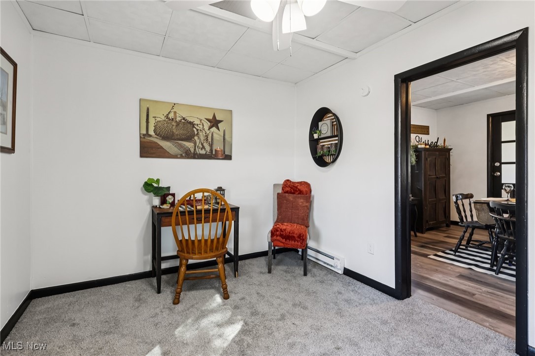1743 West Prospect Road Ashtabula, OH 44004 - Photo 26 of 43 Sitting room with a paneled ceiling, light colored carpet, and a baseboard radiator