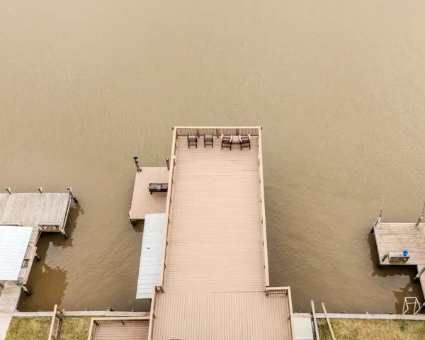 a balcony with table and chairs