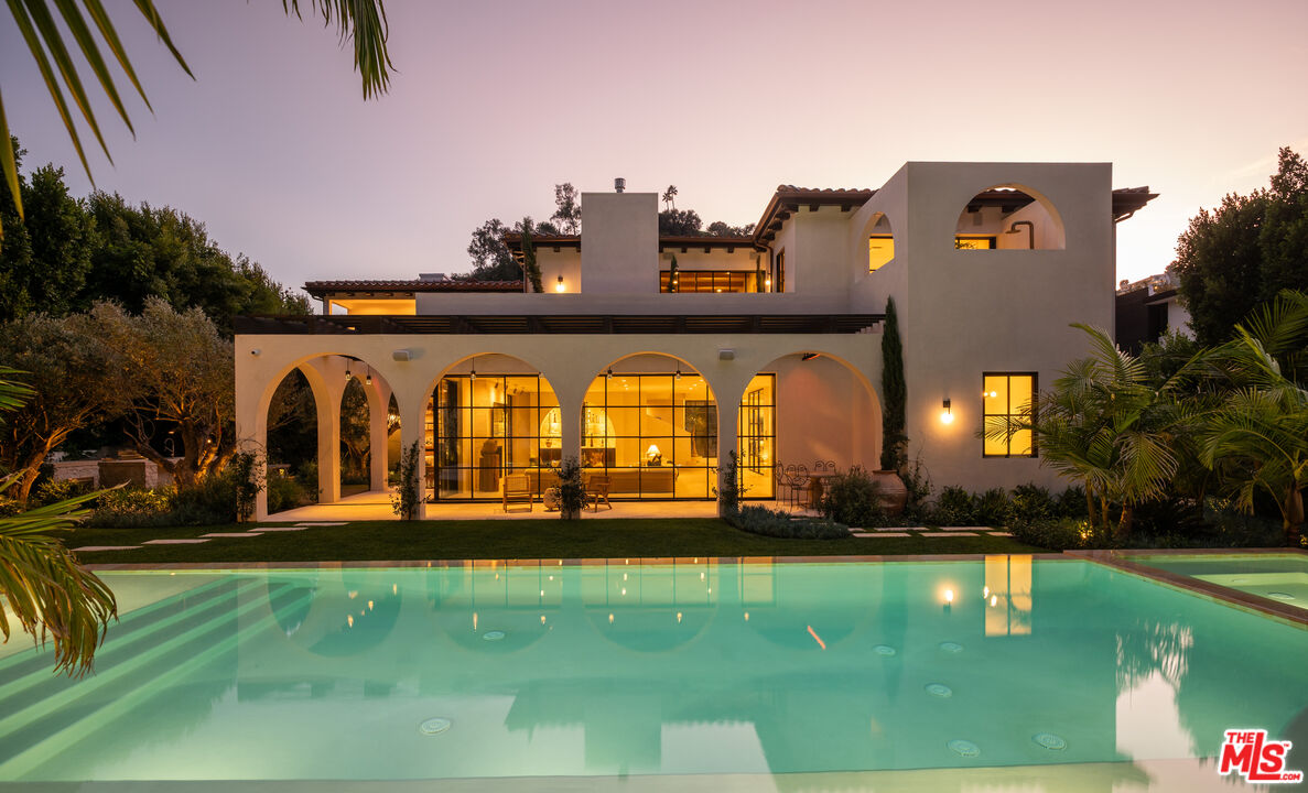966 Stone Canyon Road Los Angeles, CA 90077 - Photo 27 of 30 an aerial view of a house with swimming pool a yard and outdoor seating