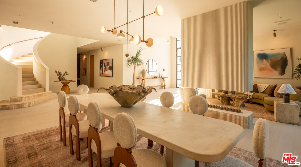966 Stone Canyon Road Los Angeles, CA 90077 - Photo 6 of 30 a view of a dining room with furniture