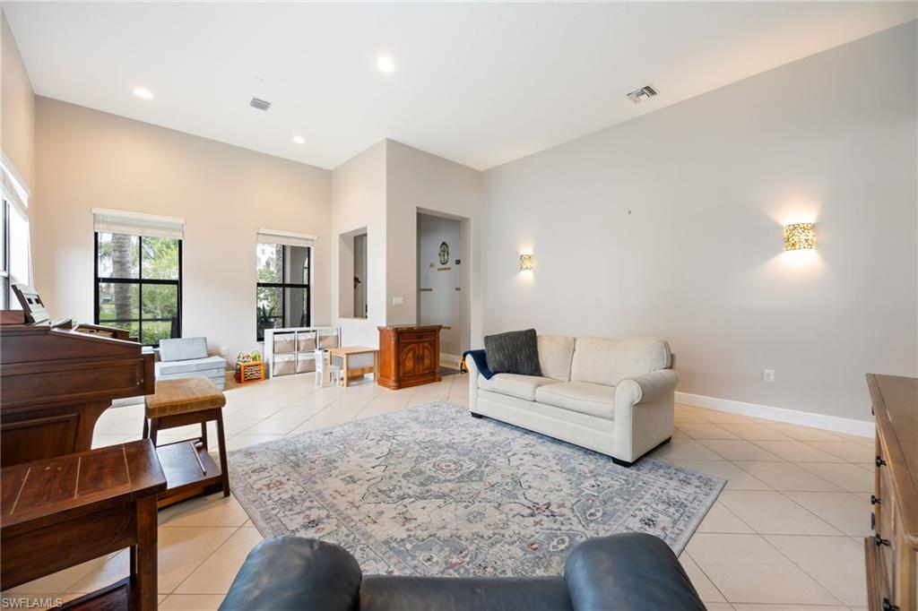 5116 Salerno Street Ave Maria, FL 34142 - Photo 6 of 36 Living area featuring light tile patterned flooring and recessed lighting