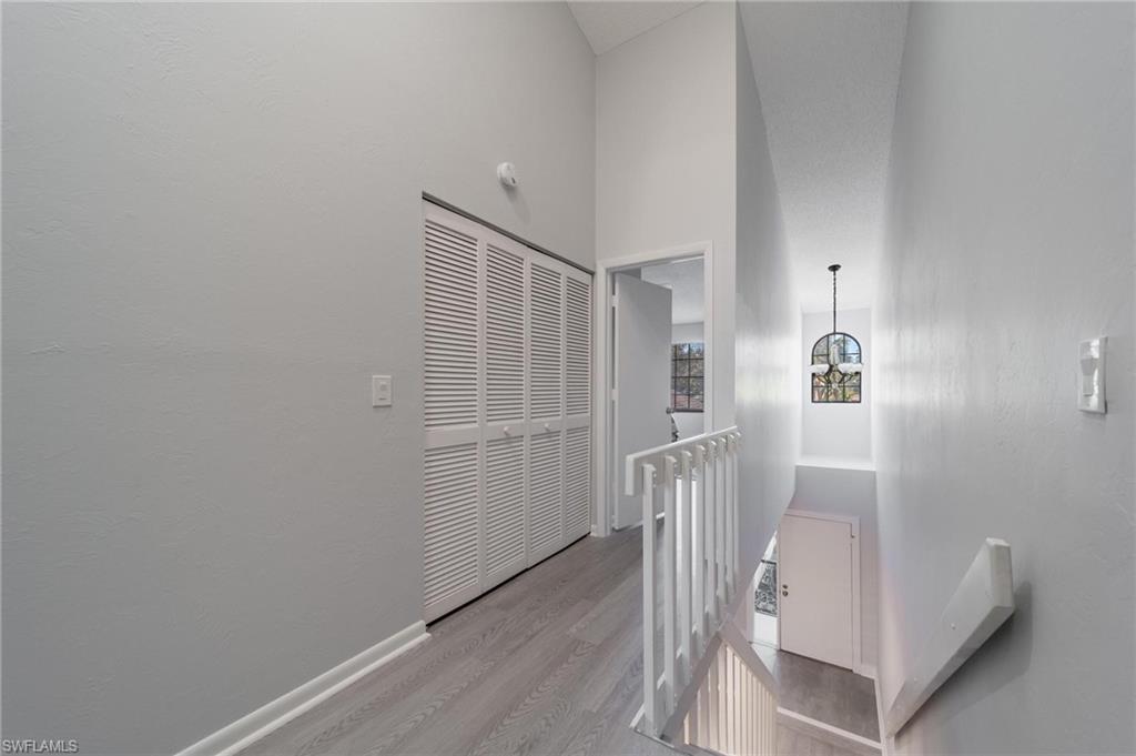 820 Meadowland Drive, Unit D Naples, FL 34108 - Photo 12 of 30 a view of entryway with wooden floor