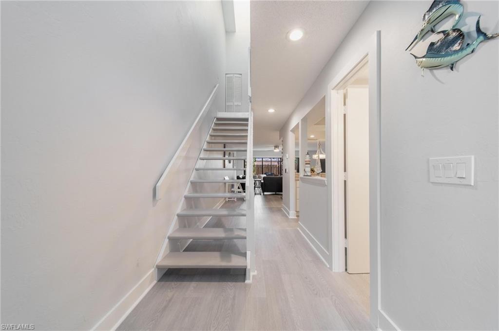 820 Meadowland Drive, Unit D Naples, FL 34108 - Photo 14 of 30 a view of entryway and hall with wooden floor