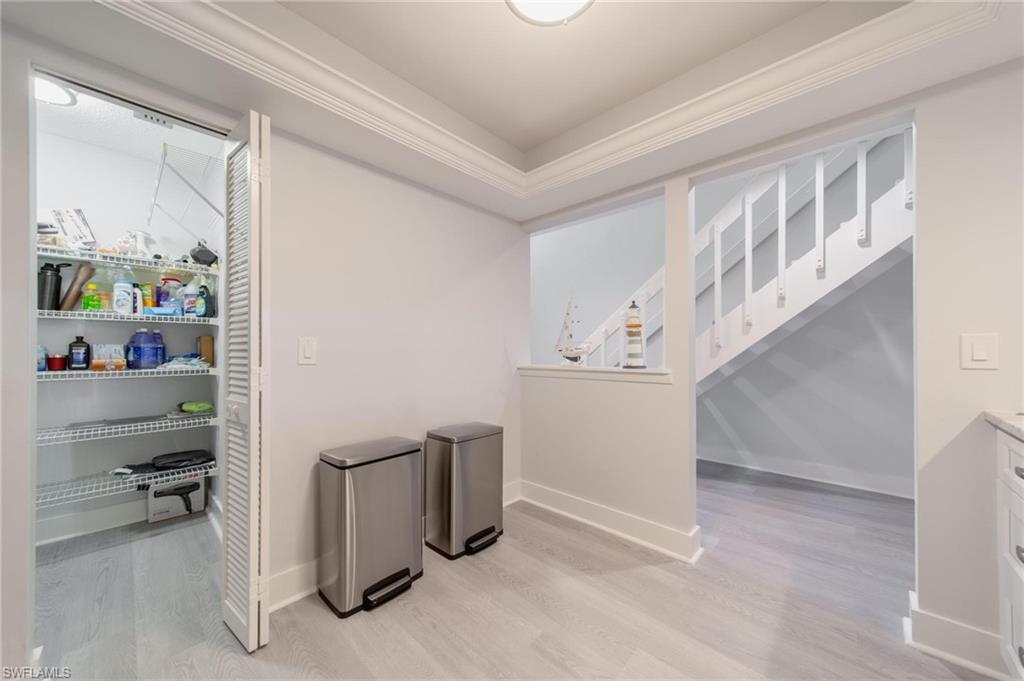 820 Meadowland Drive, Unit D Naples, FL 34108 - Photo 16 of 30 a view of entryway with workspace and stairs