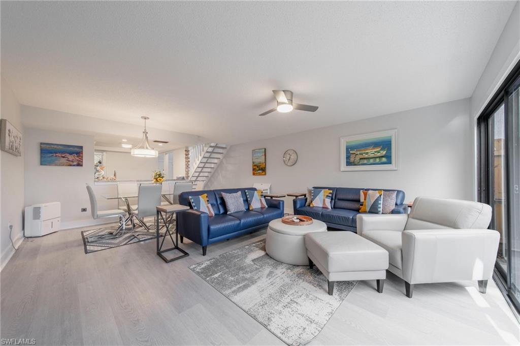 820 Meadowland Drive, Unit D Naples, FL 34108 - Photo 20 of 30 a living room with furniture and a couch