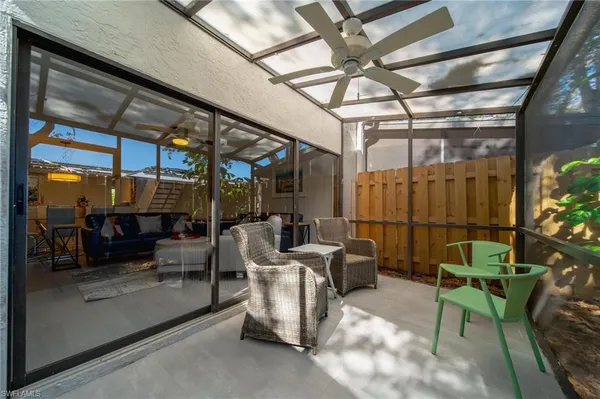 a view of a chairs and table in a room
