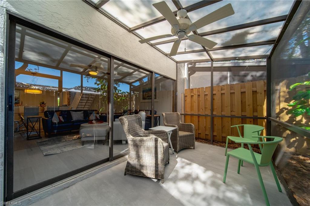820 Meadowland Drive, Unit D Naples, FL 34108 - Photo 22 of 30 a view of a chairs and table in a room