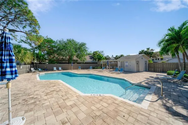 a swimming pool with wooden fence