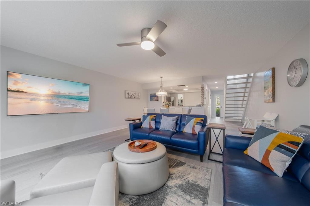 820 Meadowland Drive, Unit D Naples, FL 34108 - Photo 3 of 30 a living room with furniture and a wooden floor