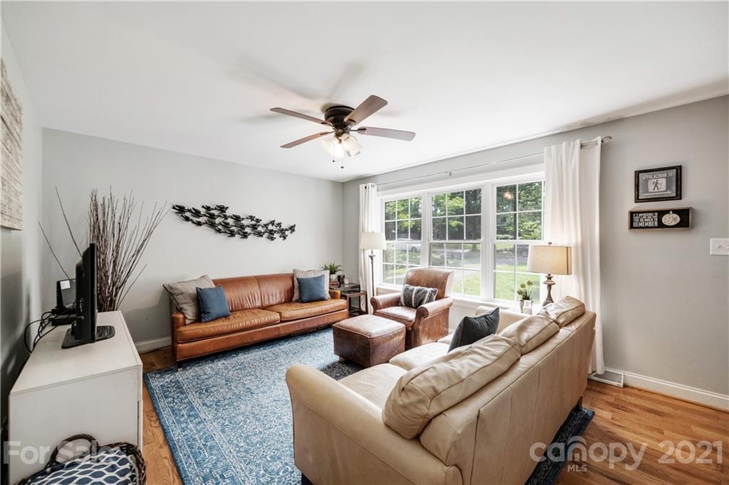 7324 Windyrush Road Charlotte, NC 28226 - Photo 2 of 27 a living room with furniture and a large window