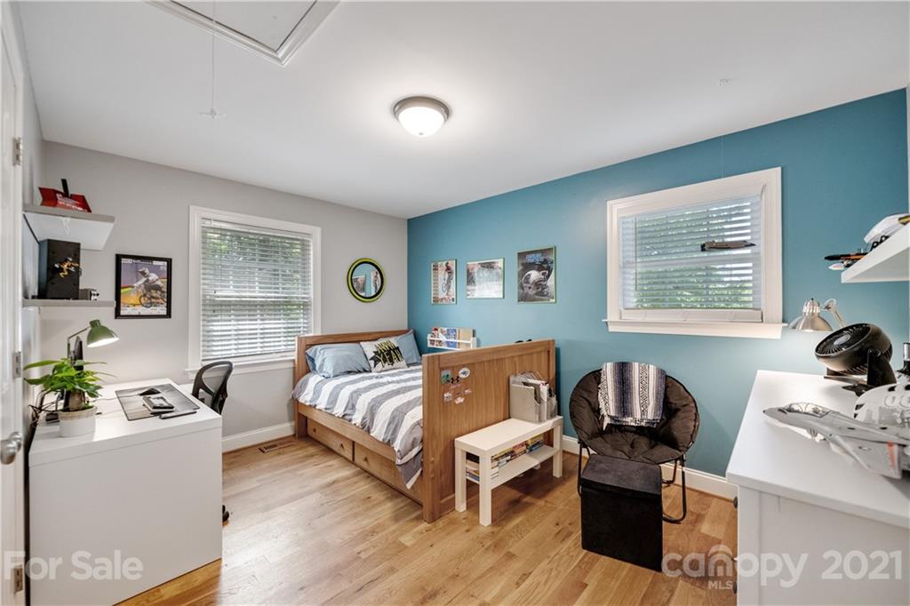 7324 Windyrush Road Charlotte, NC 28226 - Photo 15 of 27 a bedroom with furniture and a wooden floor