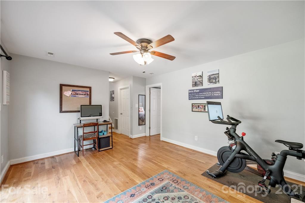 7324 Windyrush Road Charlotte, NC 28226 - Photo 18 of 27 a view of a workspace with furniture and wooden floor
