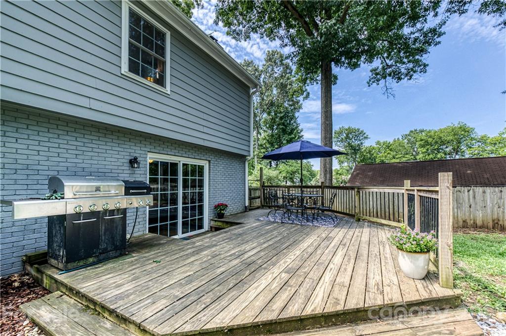 7324 Windyrush Road Charlotte, NC 28226 - Photo 21 of 27 a backyard of a house with seating space