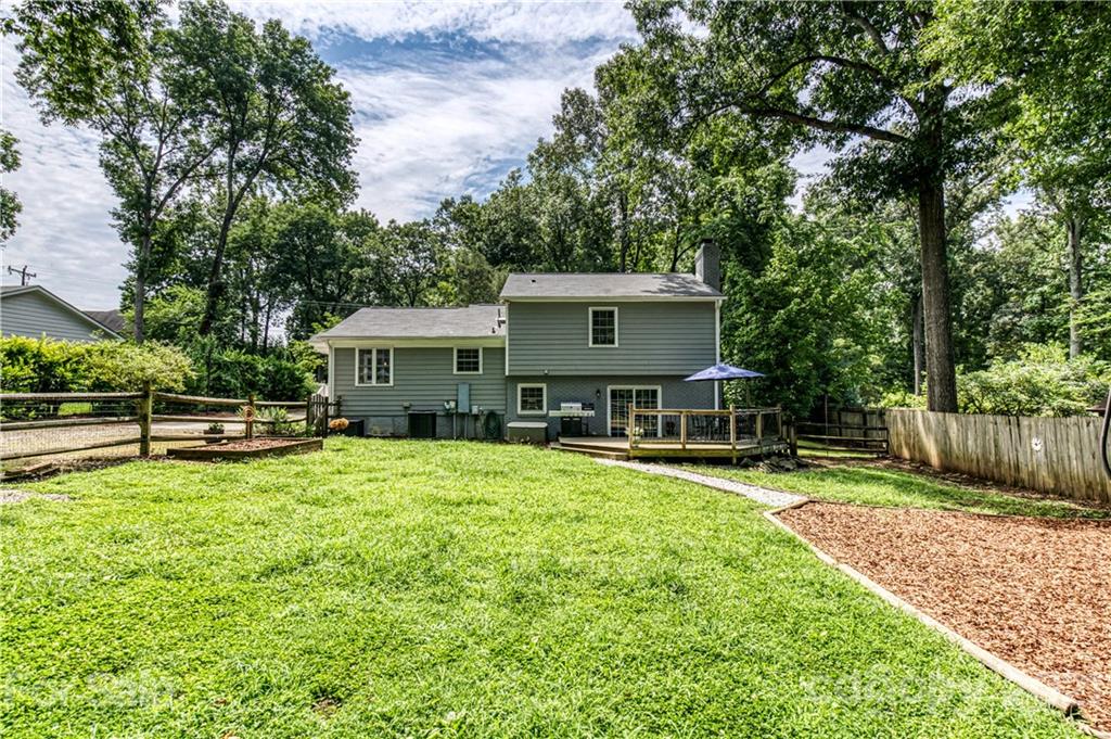 7324 Windyrush Road Charlotte, NC 28226 - Photo 24 of 27 a front view of a house with a yard table and chairs