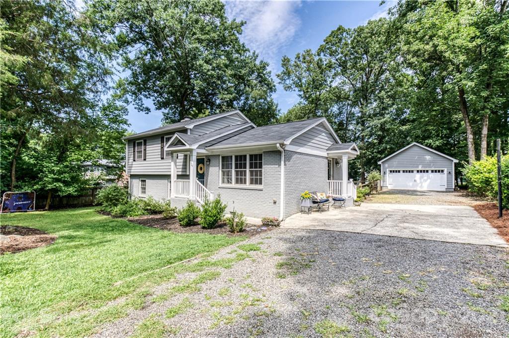 7324 Windyrush Road Charlotte, NC 28226 - Photo 26 of 27 a front view of a house with a garden