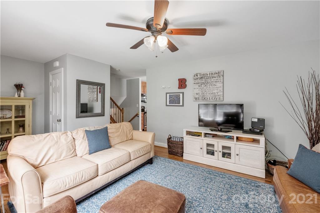 7324 Windyrush Road Charlotte, NC 28226 - Photo 4 of 27 a living room with furniture and a flat screen tv