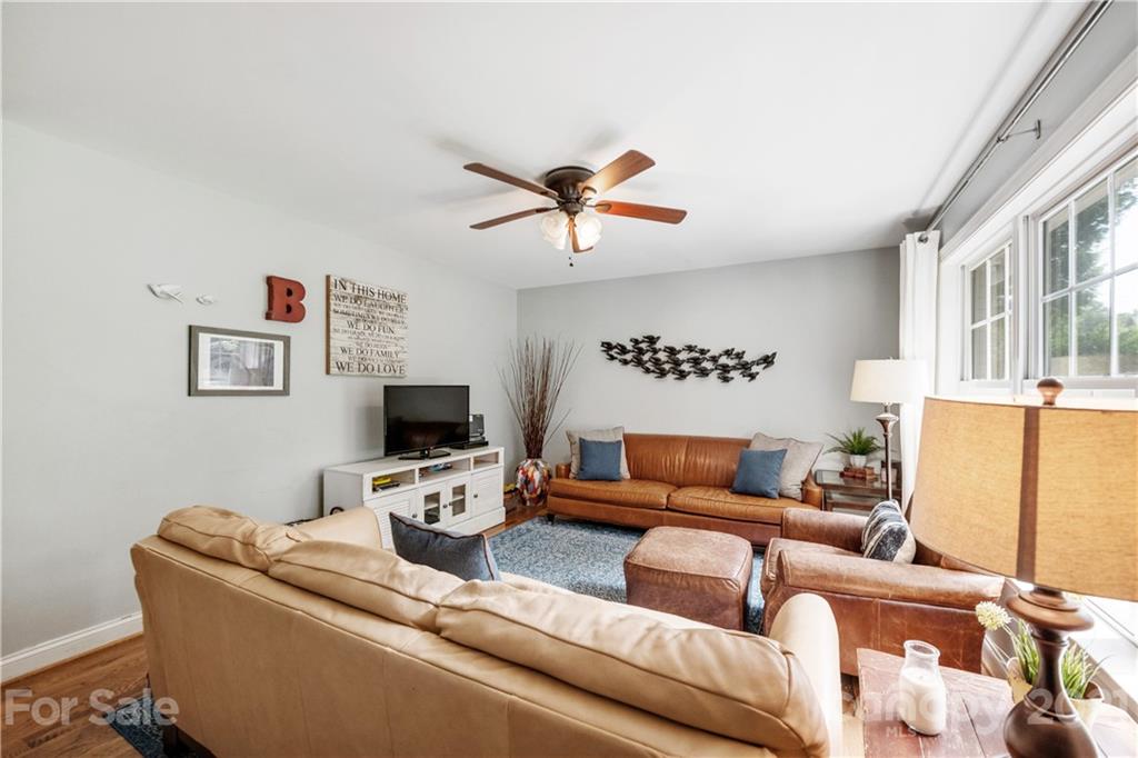 7324 Windyrush Road Charlotte, NC 28226 - Photo 5 of 27 a living room with furniture and a flat screen tv