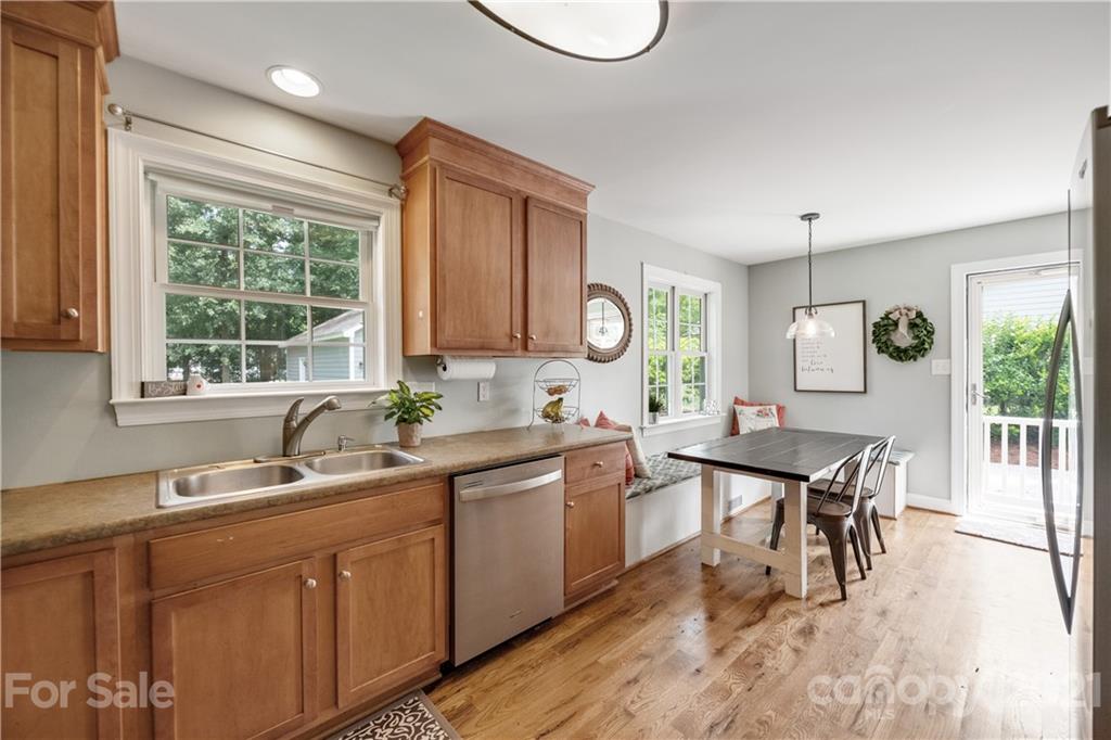 7324 Windyrush Road Charlotte, NC 28226 - Photo 7 of 27 a kitchen with a sink cabinets and window