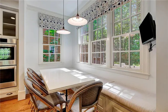 a bedroom with a bed and large window