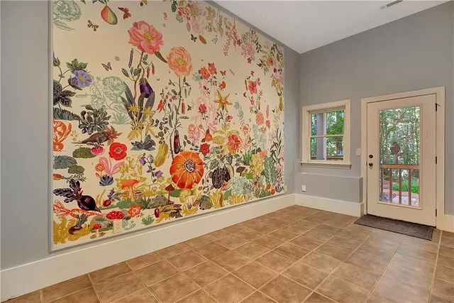 a view of entryway with window and flower pot