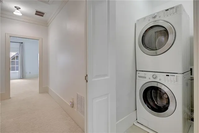 a view of a hallway with washer and dryer