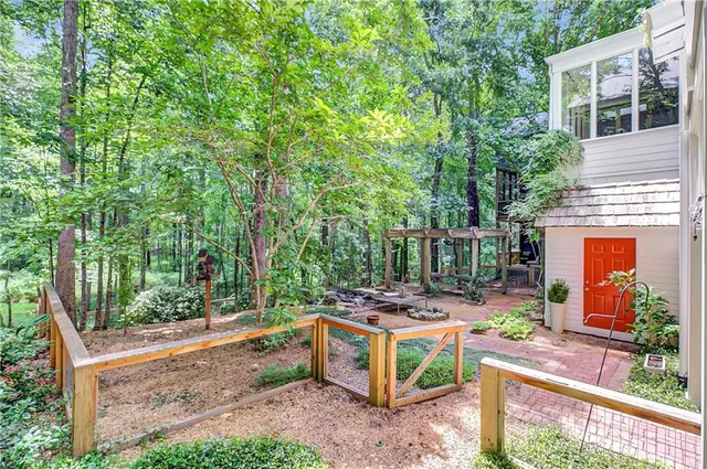 a view of a chairs and fire pit in the yard