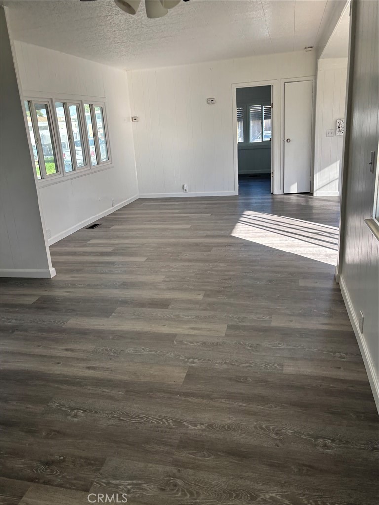2499 East Gerard Avenue, Unit 32 Merced, CA 95341 - Photo 3 of 7 a view of an empty room and window