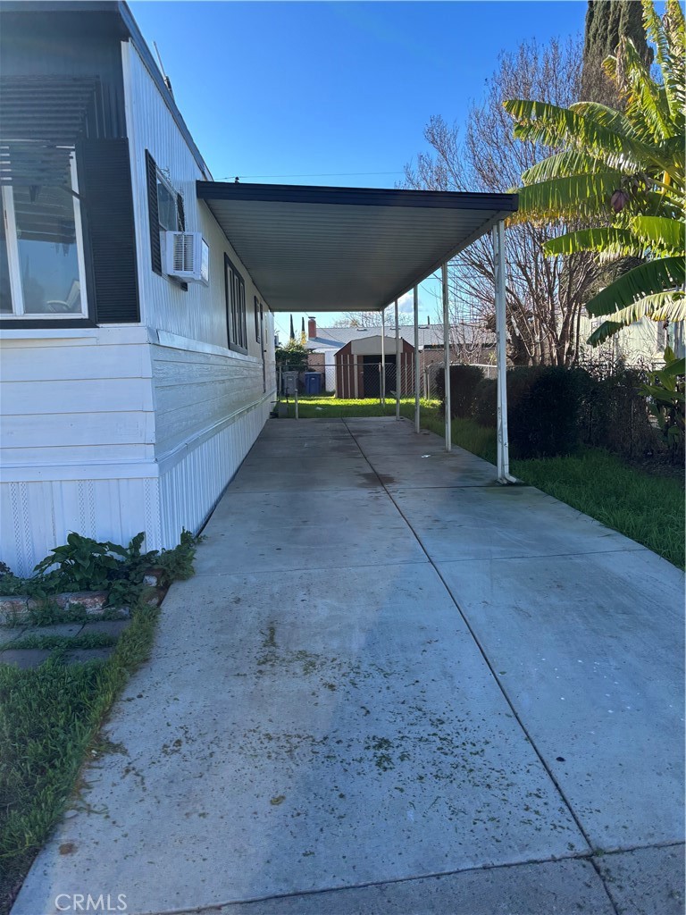 2499 East Gerard Avenue, Unit 32 Merced, CA 95341 - Photo 5 of 7 a view of a backyard with plants and large tree