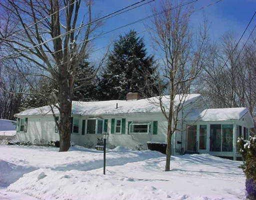135 Stony Brook Road Framingham, MA 01702 - Photo 1 of 1 a front view of a house with a tree