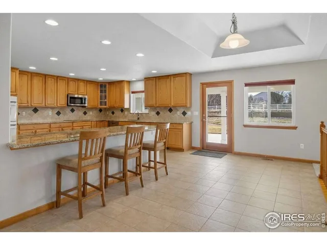 a bathroom with a sink a mirror and a shower