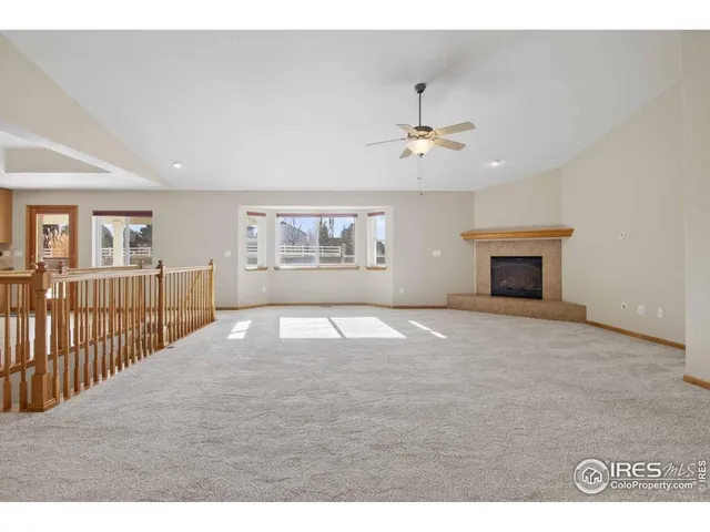 a bathroom with a granite countertop sink a mirror and a shower