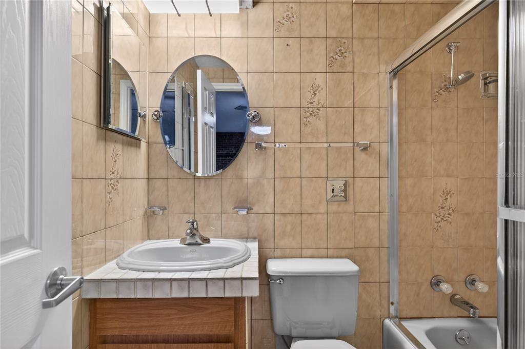 11 Reyes Road DeLand, FL 32724 - Photo 15 of 37 a bathroom with a sink a toilet and shower