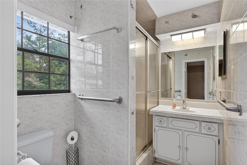 11 Reyes Road DeLand, FL 32724 - Photo 23 of 37 a bathroom with a double vanity sink mirror and shower