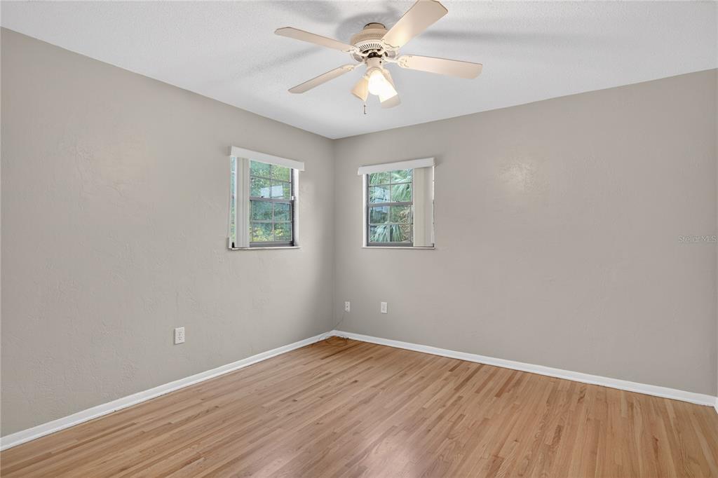11 Reyes Road DeLand, FL 32724 - Photo 25 of 37 wooden floor in an empty room with a window