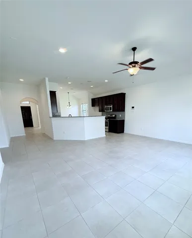 a view of room window and ceiling fan