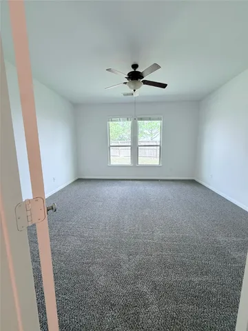 a spacious bathroom with a bathtub and a shower