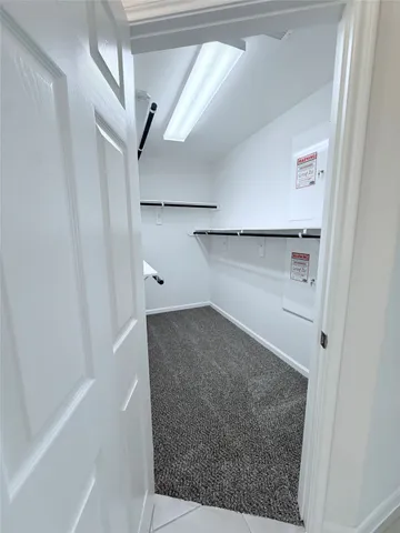 a bathroom with a glass door shower