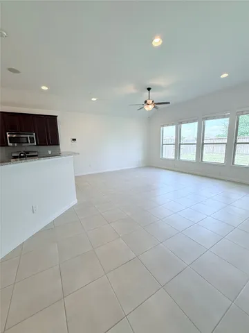a kitchen with a sink and a stove top oven