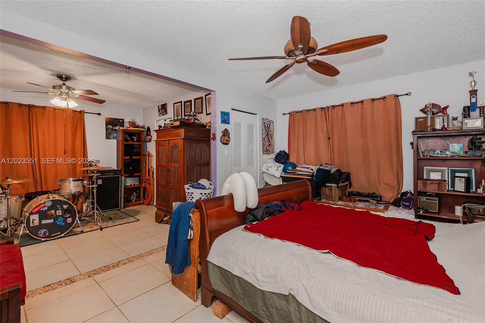 11482 Southwest 109th Road, Unit 29A Miami, FL 33176 - Photo 17 of 28 a room with gym equipment and a chandelier