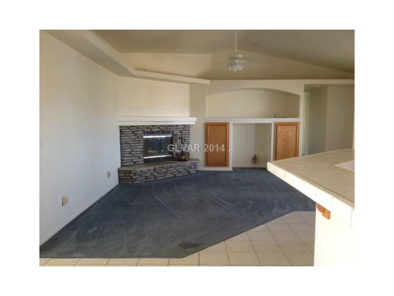 381 Big Five Road Pahrump, NV 89048 - Photo 9 of 35 Den. Nice Open Great room/living room. Pot Shelves .