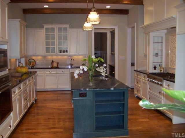 5331 Landguard Drive Raleigh, NC 27613 - Photo 6 of 10 THE SPECTACULAR KITCHEN W/ THERMADOR APPLIANCES,SOAPSTONE ISLAND WHICH WON AN AWARD ALSO, ICE MAKER, ROUGH SAWN BEAMS IN KITCHEN FOR A 'FRENCH COUNTRY' LOOK Other