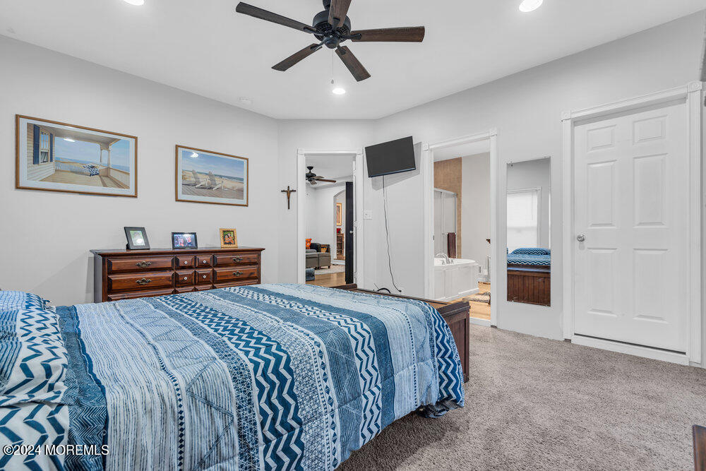 15 Blake Drive Howell, NJ 07731 - Photo 22 of 35 a bed room with a bed and a ceiling fan