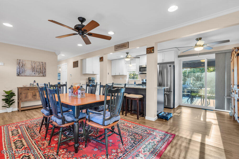 15 Blake Drive Howell, NJ 07731 - Photo 8 of 35 a living room with dining room and wooden floor