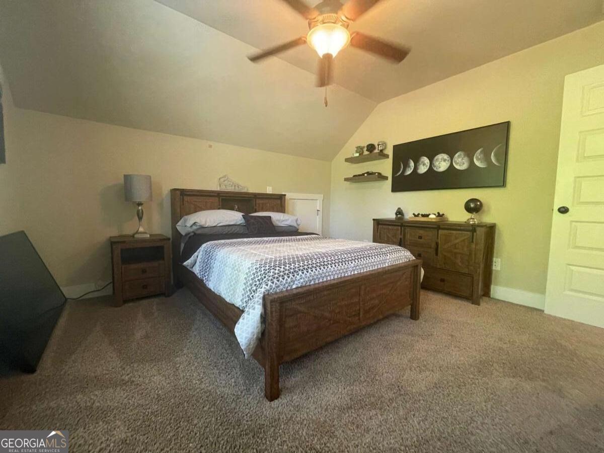457 Old Good Hope Road Good Hope, GA 30641 - Photo 16 of 59 a bedroom with a bed dresser and window